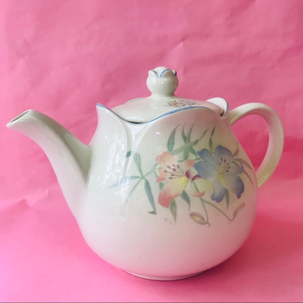 Vintage porcelain tea pot with floral design